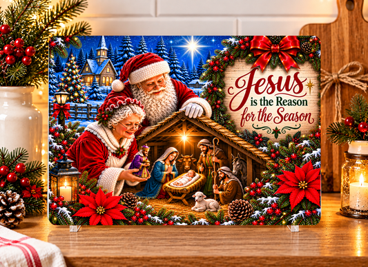 Tempered glass cutting board featuring Mr. and Mrs. Claus at the nativity scene with Jesus is the Reason for the Season scripture